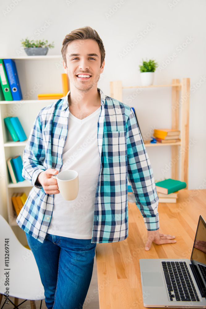 Handsome smiling man having break and drinking Handsome smiling man having break and drinking