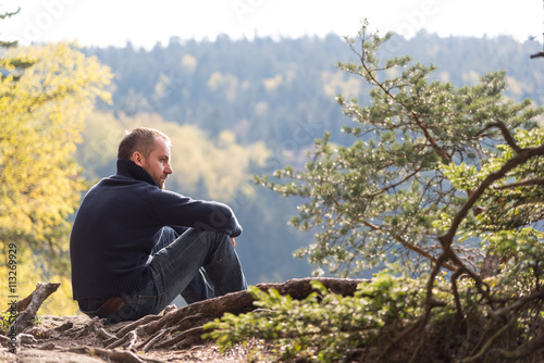Man contemplating in mountains