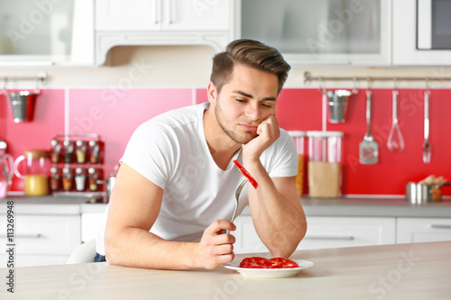 Man and healthy food in kit...