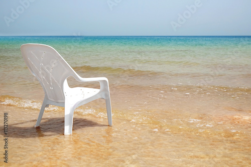 Chair on the beach of Dead Sea