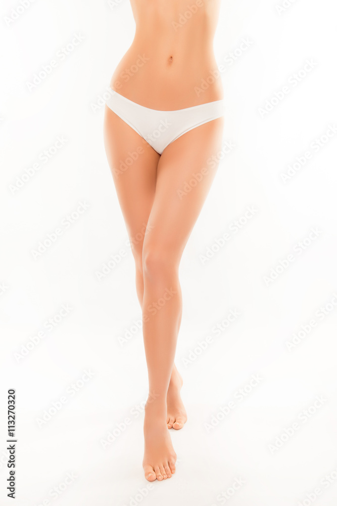 Long smooth woman's legs and slim muscular belly