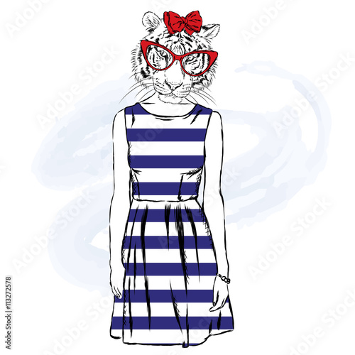 Fototapeta Naklejka Na Ścianę i Meble -  Tigress hipster in a dress.  Fashion & Style. Hipster in summer clothes.