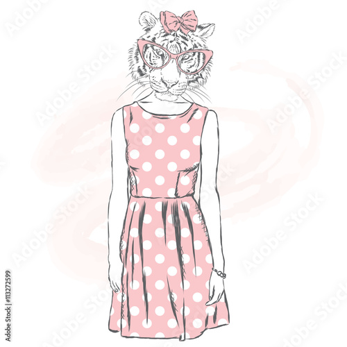 Fototapeta Naklejka Na Ścianę i Meble -  Tigress hipster in a dress.  Fashion & Style. Hipster in summer clothes.