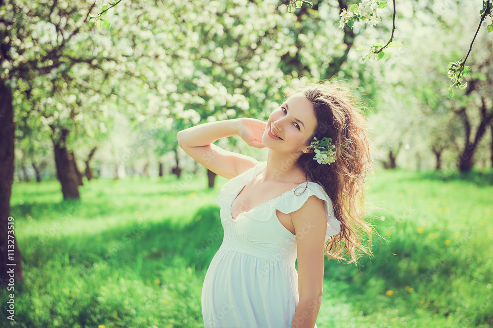Pregnant beautiful woman in the apple orchard Pregnant beautiful woman in the apple orchard