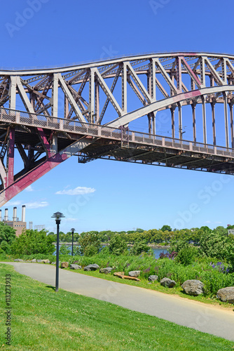 The Hell Gate Bridge (East River Arch Bridge) in New York City is a railroad only bridge, not used for passenger cars, and was a model for the Sydney Harbour Bridge in Australia photo