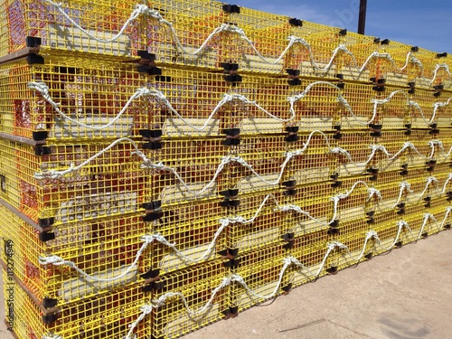 stacked yellow lobster traps