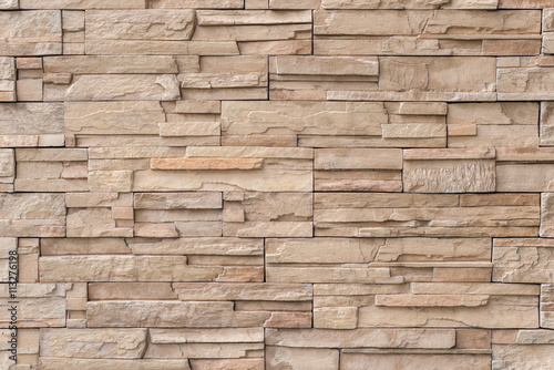 Close up light brown stone wall texture background