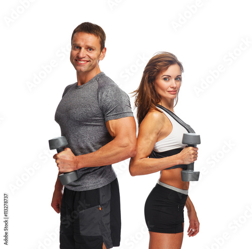 Sporty couple with dumbbells.