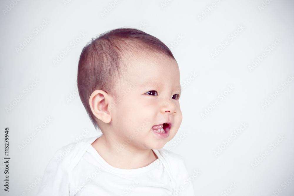 Baby happy on the white background, new family and love concept Baby happy on the white background, new family and love concept