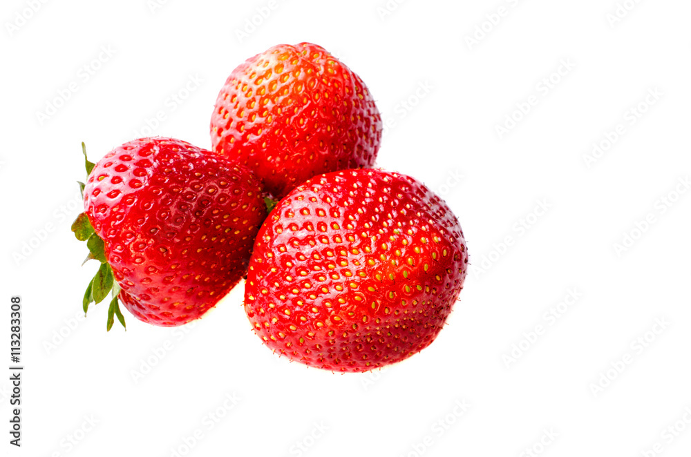 Three ripe strawberries isolated on white background. Three ripe strawberries isolated on white background.