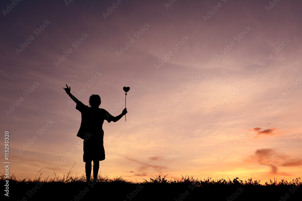 Silhouette hand holding heart shape Silhouette hand holding heart shape
