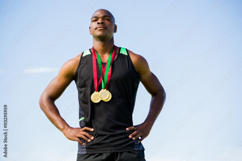 Fototapeta premium Athlete with gold medals around his neck