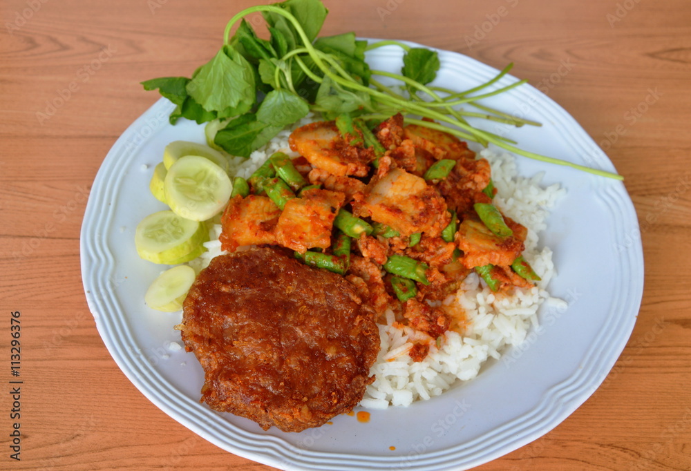 deep fried minced pork and spicy crispy pork curry on rice deep fried minced pork and spicy crispy pork curry on rice
