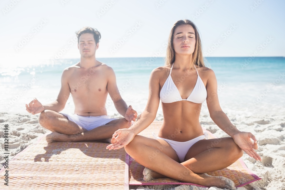  Happy couple doing yoga