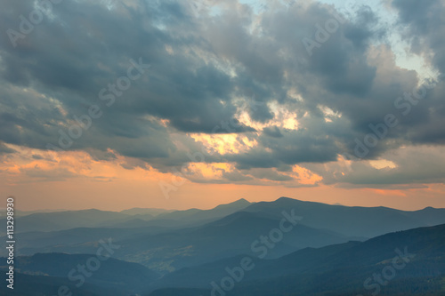 Sundown Sky and Mountains Range Background