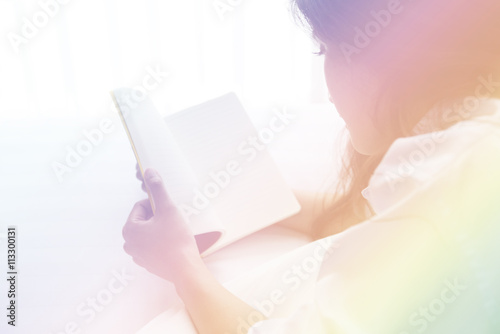 Beautiful woman reading a diary in the bedroom. Digital art for