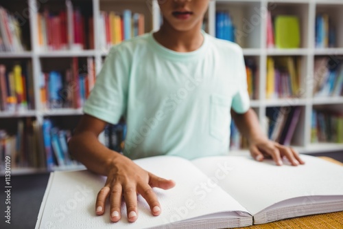 Fotografie Boy using braille to read