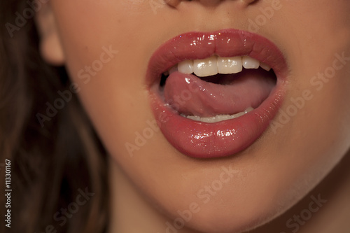 woman touching her lips with tongue