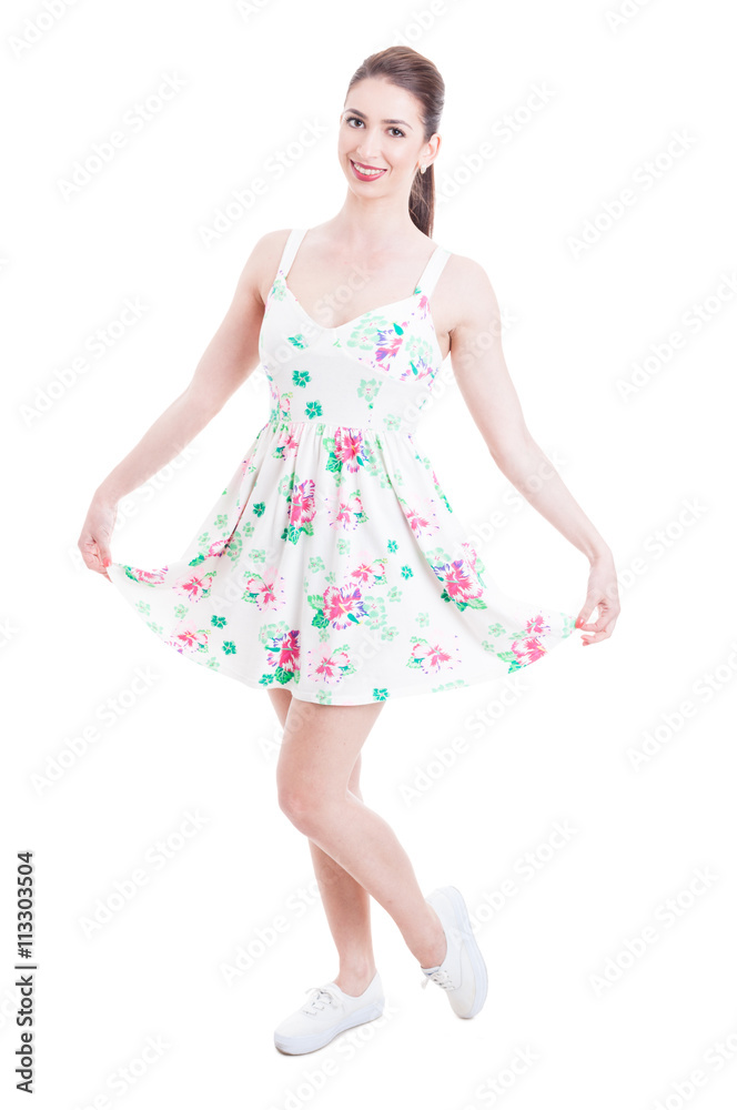 Naklejka premium Pretty lady smiling and posing in summer dress