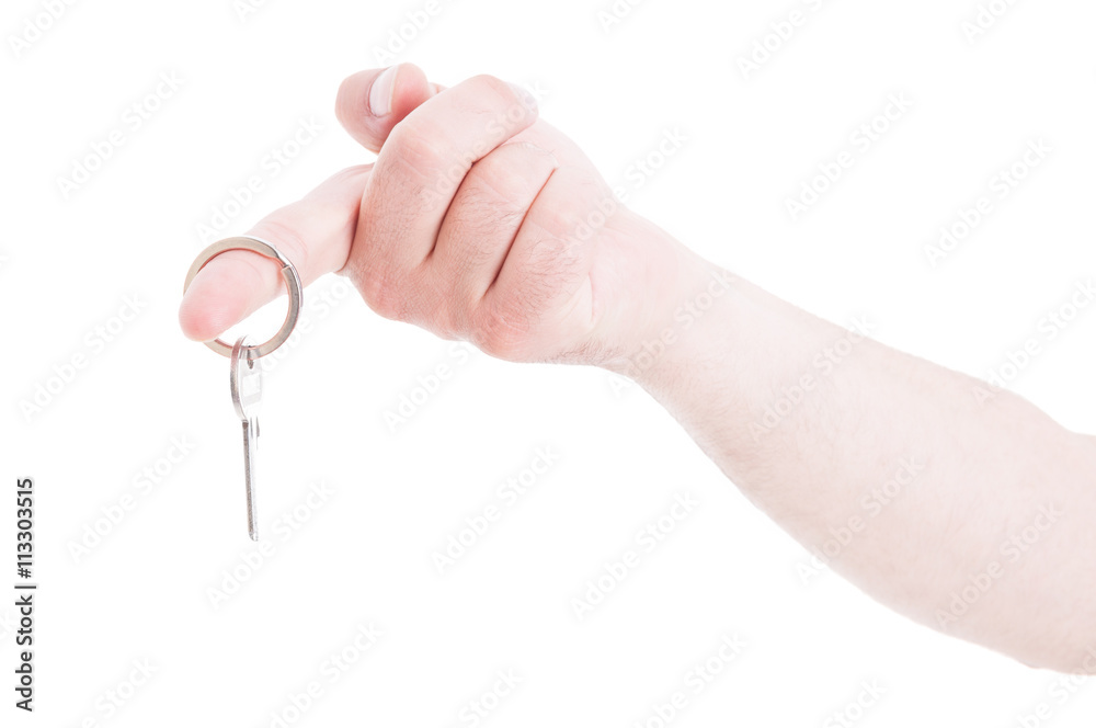 Male hand holding keyring on index finger as real estate