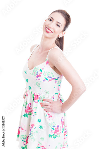 Attractive lady side posing studio concept wearing summer dress