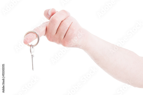 Male hand holding keyring on index finger as real estate