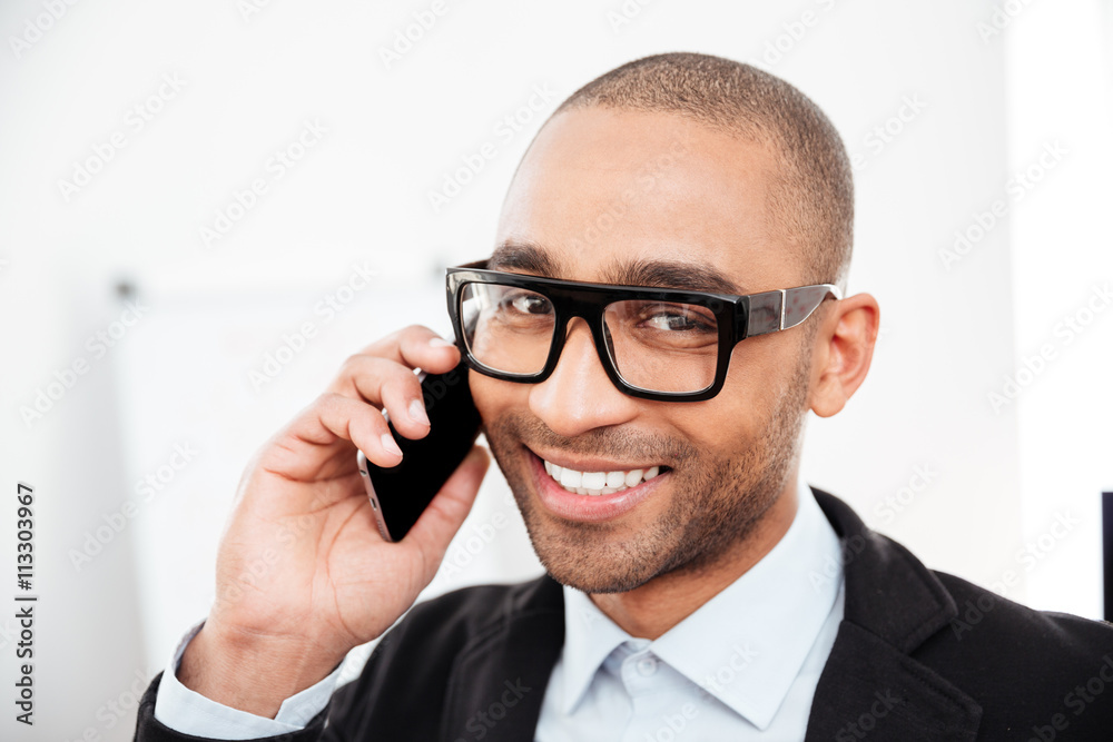 Close-up portrait of businessman talking on the mobile phone Close-up portrait of businessman talking on the mobile phone