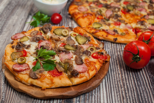  pizza  with mushrooms and pepperoni   tomatoes
