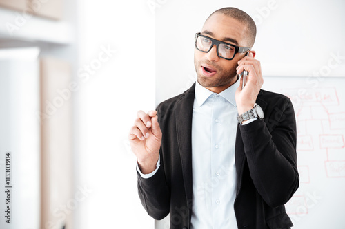 Portrait of businessman talking on the mobile phone