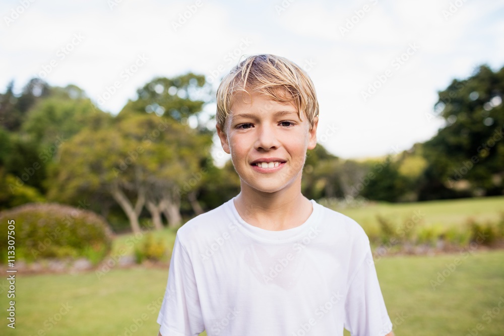Kid posing at camera during a sunny day 