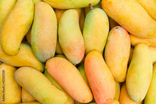 Mangoes stack at fruit market, top view