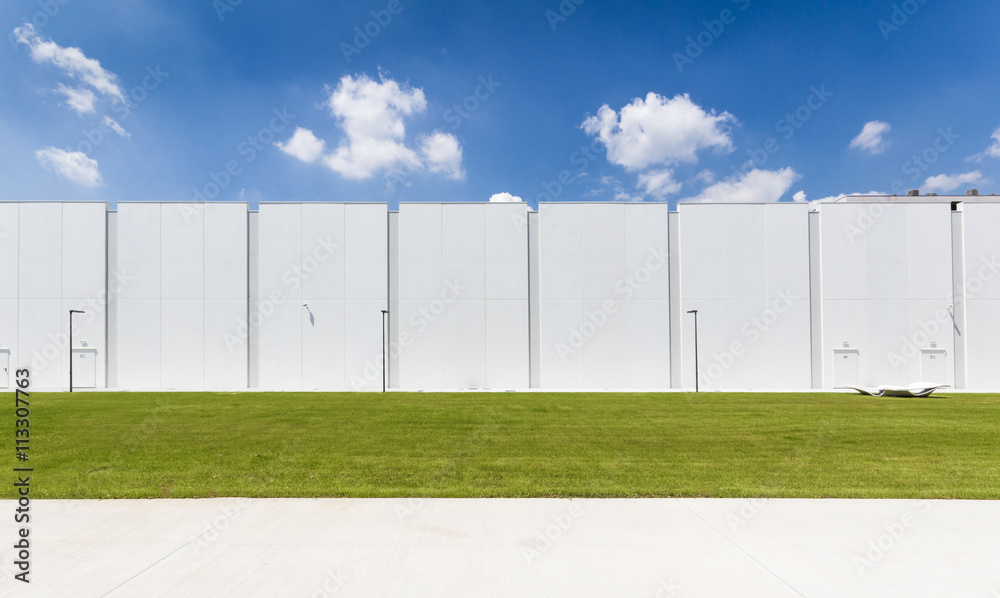 New white warehouse with blue sky