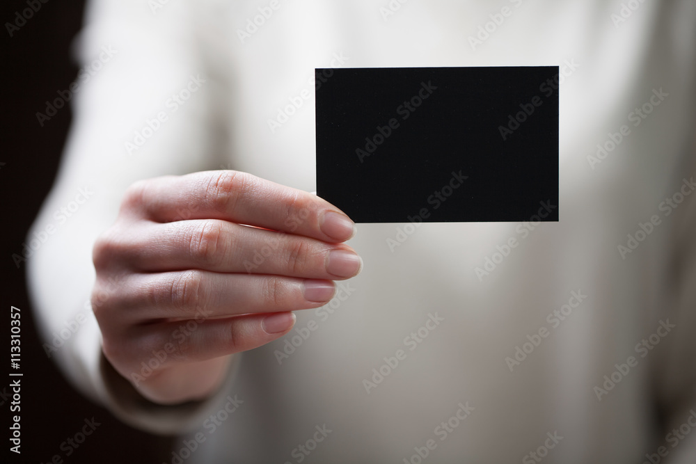 Hand holding blank business card Hand holding blank business card