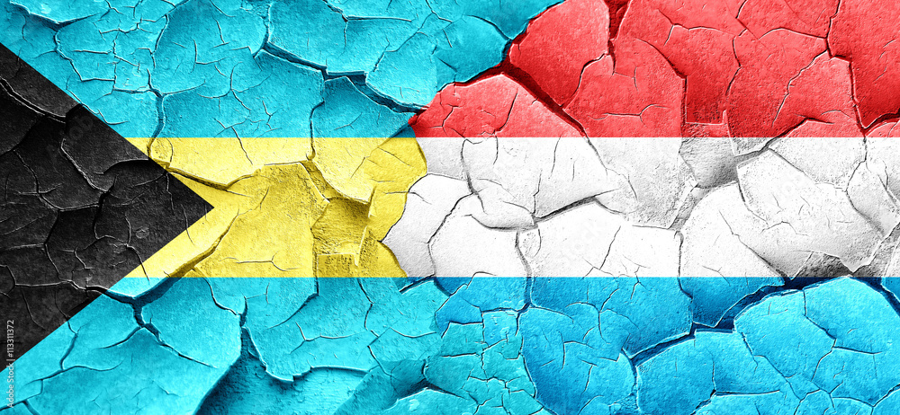 Bahamas flag with Luxembourg flag on a grunge cracked wall