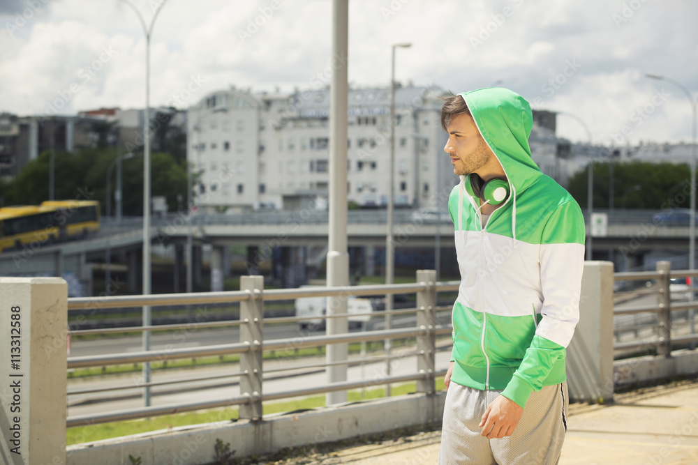 Outdoors portrait of a urban young man with headphones Outdoors portrait of a urban young man with headphones