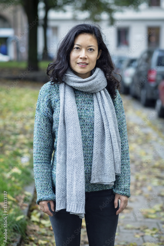 Portrait of woman standing on sidewalk Portrait of woman standing on sidewalk