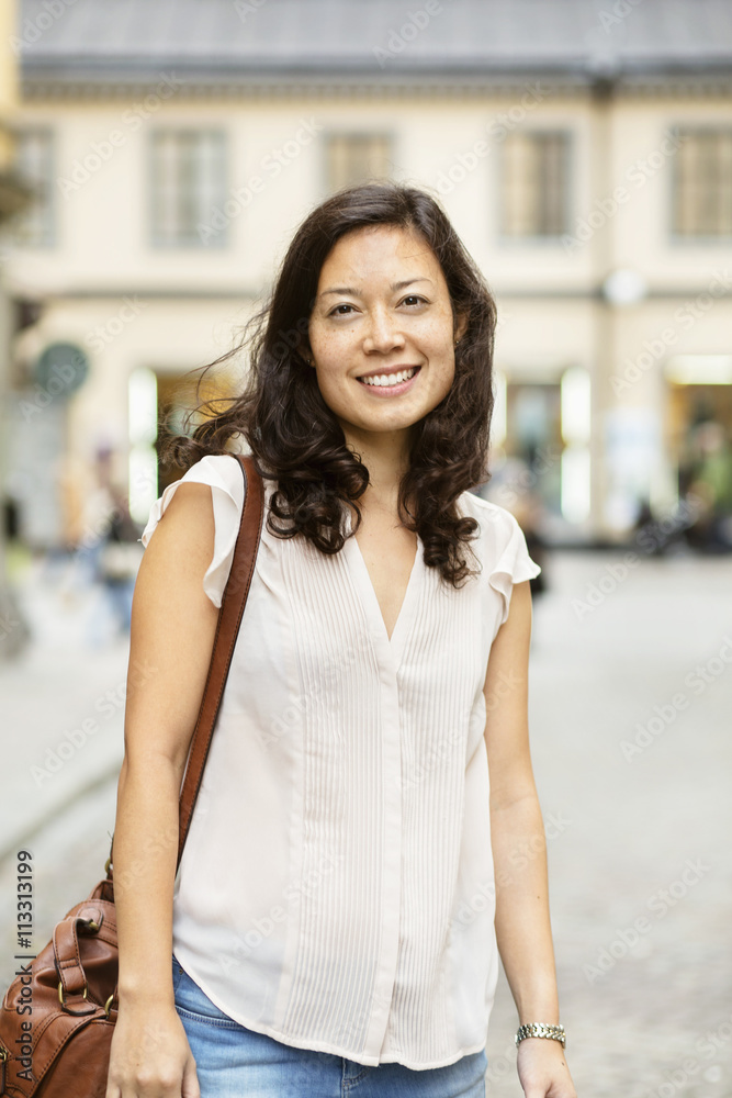 Portrait of smiling woman on street Portrait of smiling woman on street