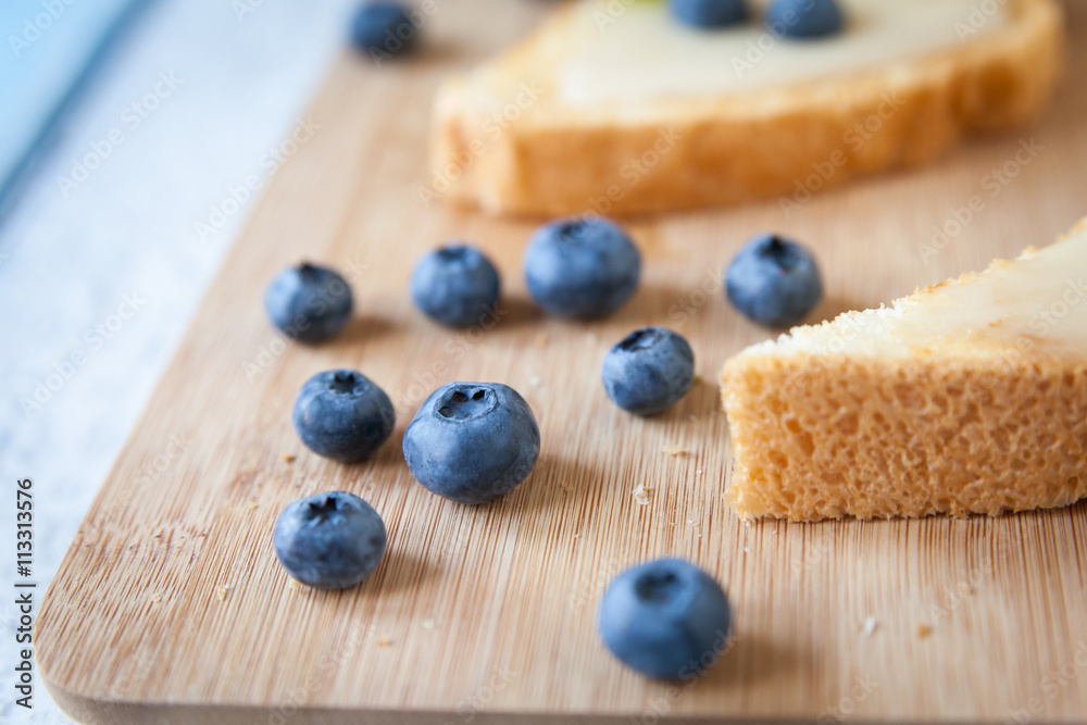 Blueberries close-up. Sandwiches with cream honey