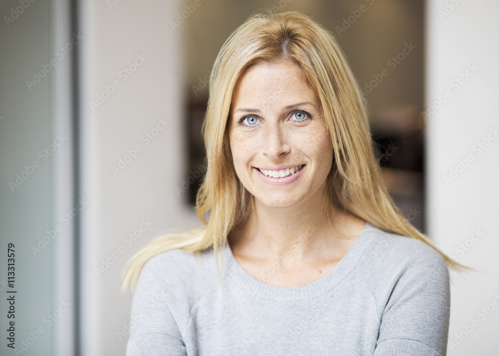Portrait of smiling mid adult woman in shopping mall Portrait of smiling mid adult woman in shopping mall