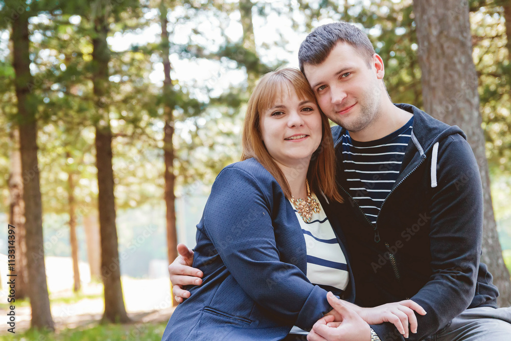 Obraz premium Cheerful Romantic Couple in Love Huging Together