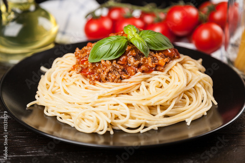 Spaghetti bolognese on dark background