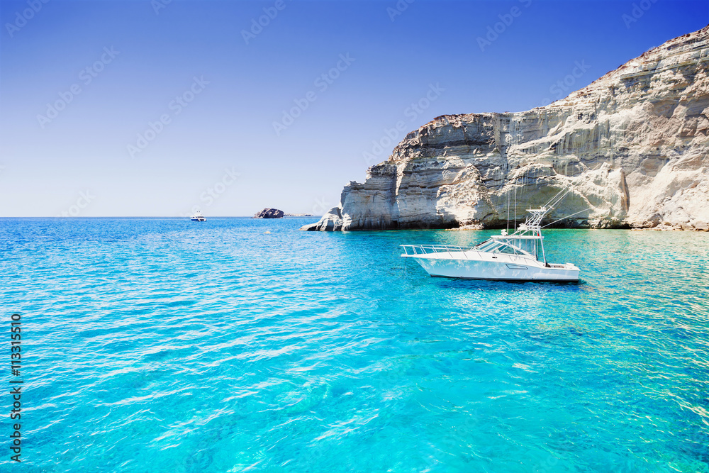 Sailboat in a beautiful bay, Milos island, Greece - obrazy, fototapety, plakaty 