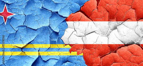 aruba flag with Austria flag on a grunge cracked wall