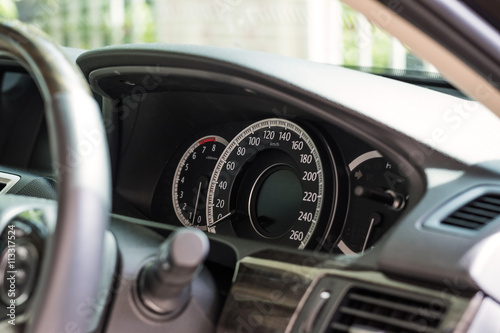 Close-up car console with car speedometer of modern car, selective soft focus 