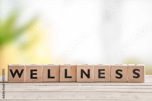 Wooden sign with the word wellness
