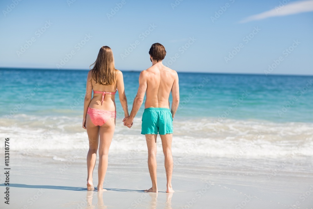 Couple standing on beach