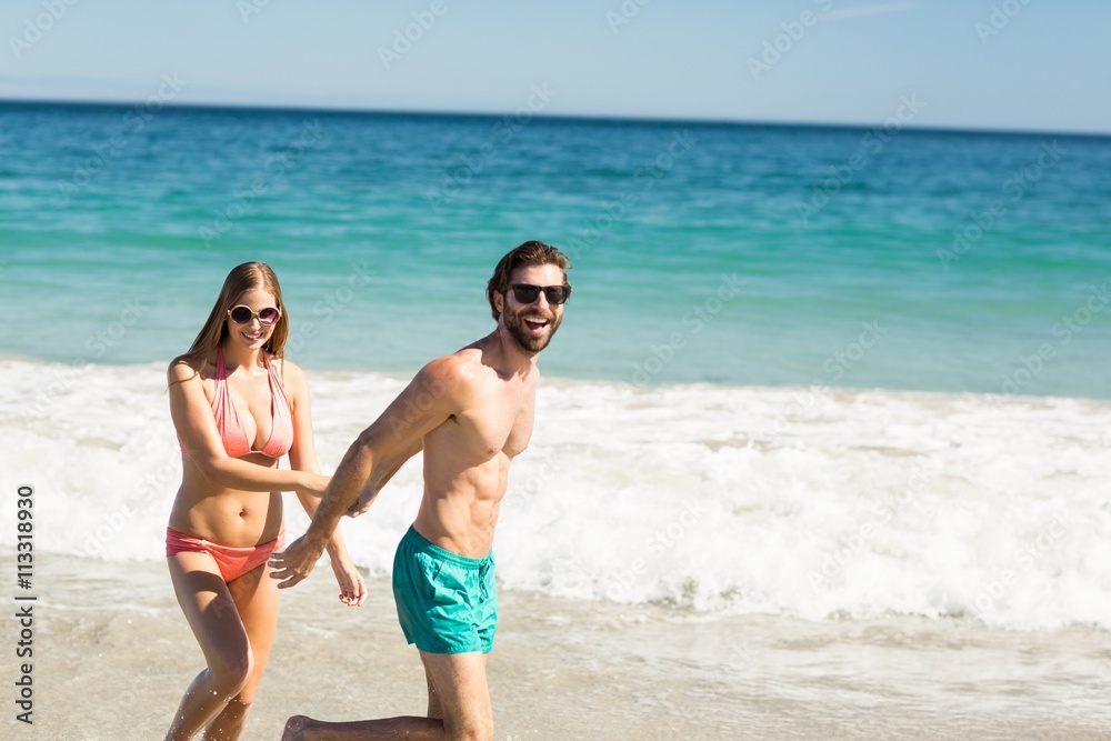 Couple walking on beach Couple walking on beach