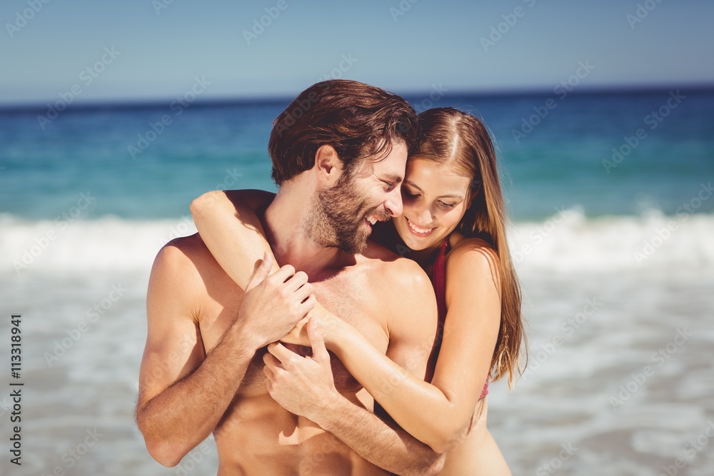 Couple embracing on beach