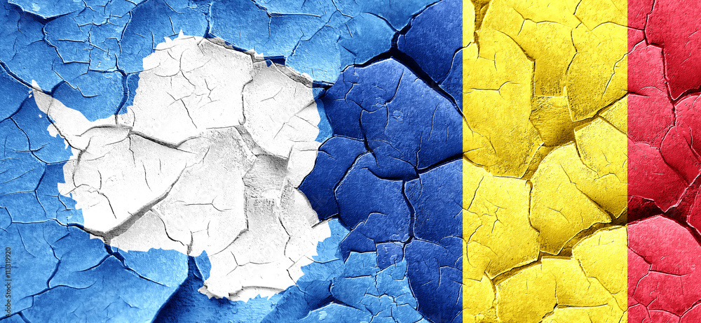 antarctica flag with Romania flag on a grunge cracked wall