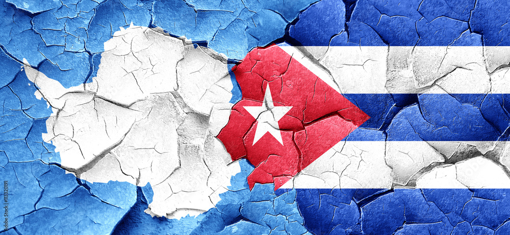 antarctica flag with cuba flag on a grunge cracked wall